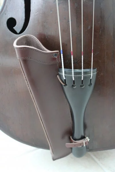 Close up of brown leather double bass bow quiver fitted