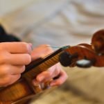 Changing the strings on a violin